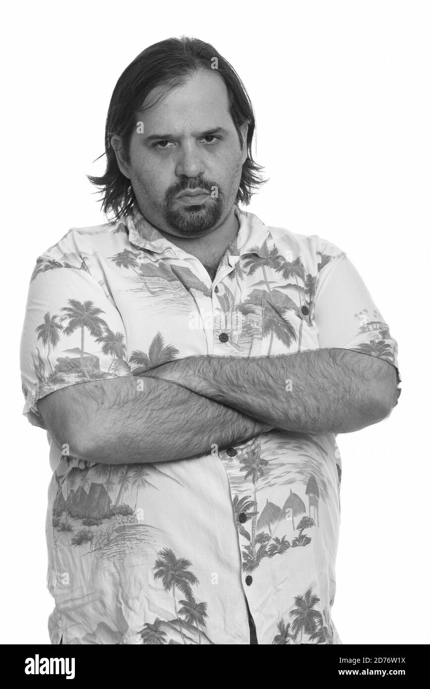 Fat Caucasian man looking angry with arms crossed Stock Photo