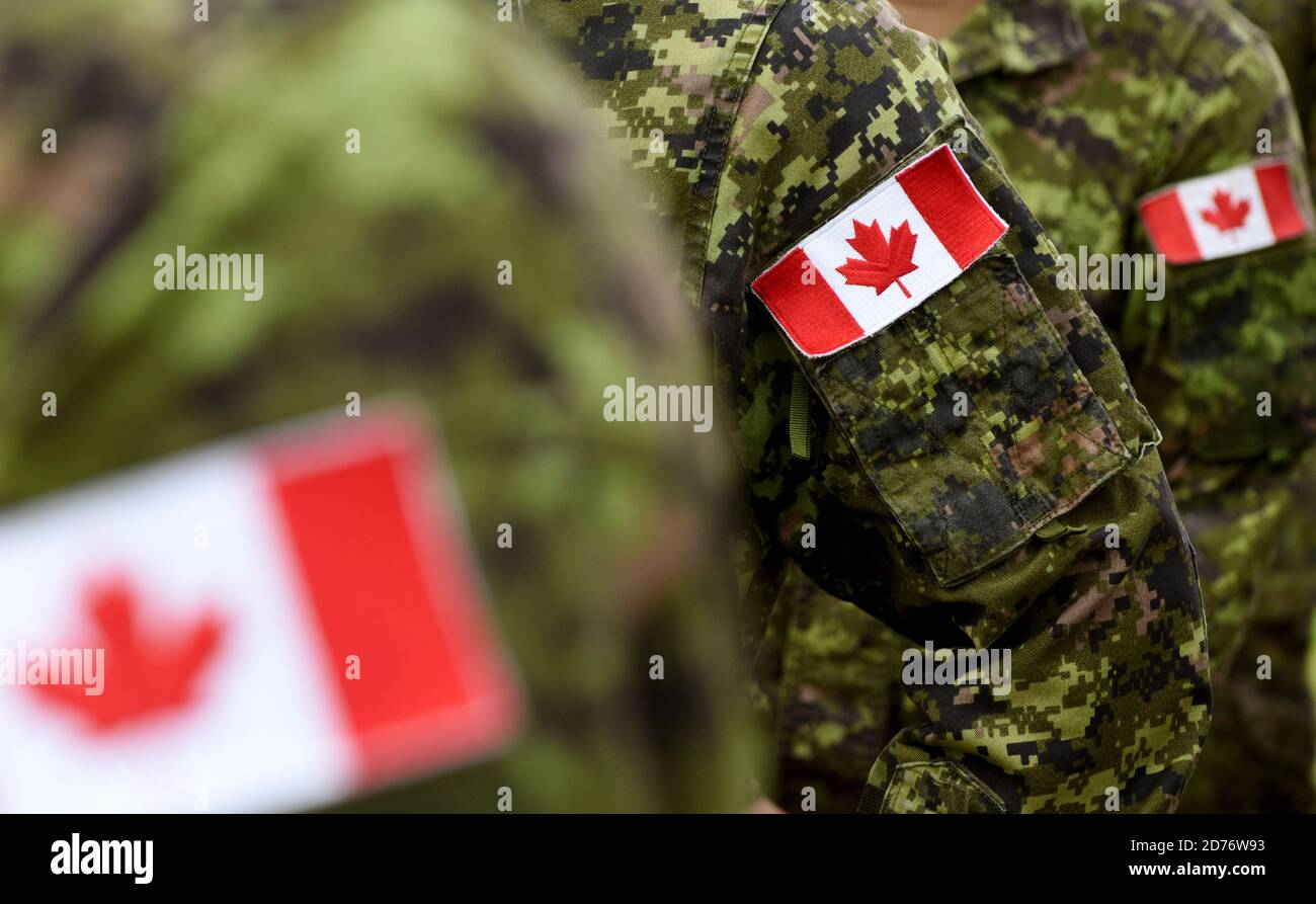 Canada Day. Flag of Canada on the military uniform and red Maple leaf ...