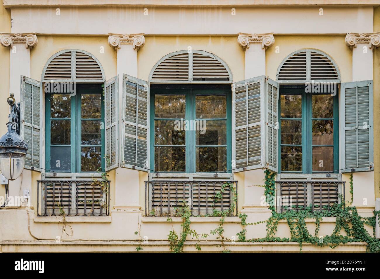 Old turquoise windows of a neoclassical style residential house Stock ...