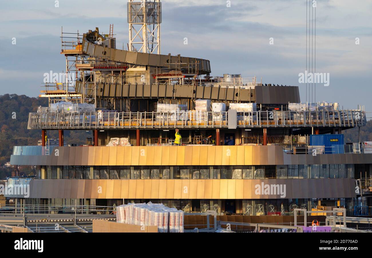Edinburgh, Scotland, UK. 21 October 2020. Sunrise view of construction work at new St James Quarter property development in central Edinburgh. The new development has shopping, residential and hotel space. Pictured is the distinctive curved outline of the new W Edinburgh hotel being clad in copper coloured cladding. Iain Masterton/Alamy Live News Stock Photo