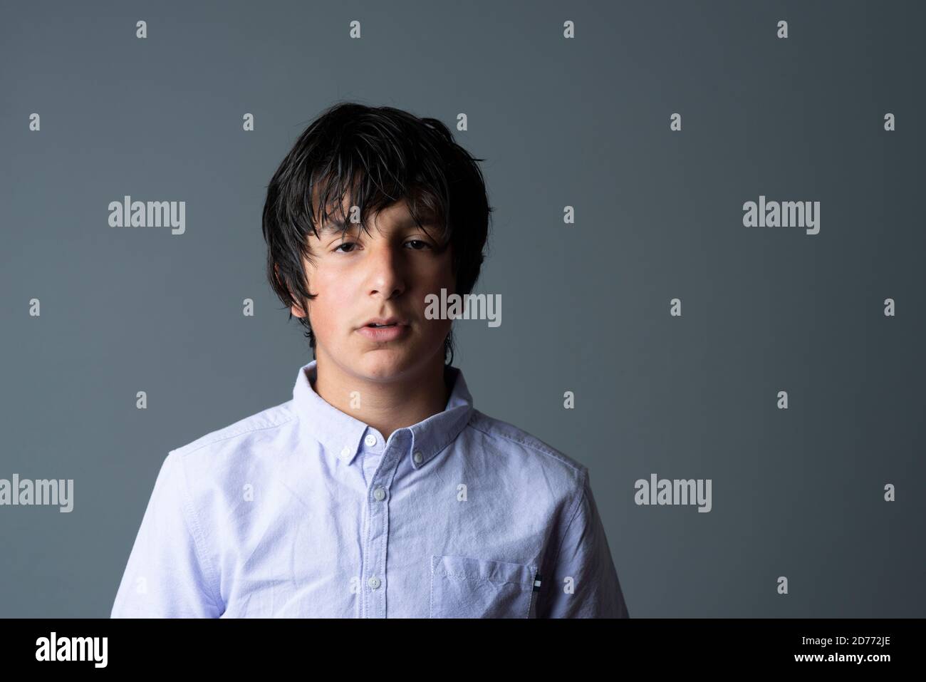 Moody italian teenager, age 12-13 years, studio shot Stock Photo