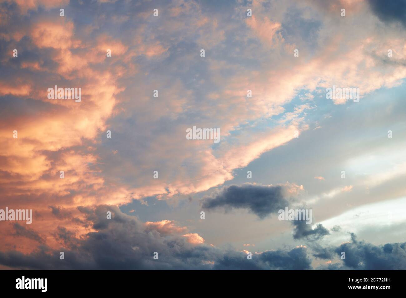 Beautiful sky with clouds lit by the setting sun Stock Photo - Alamy