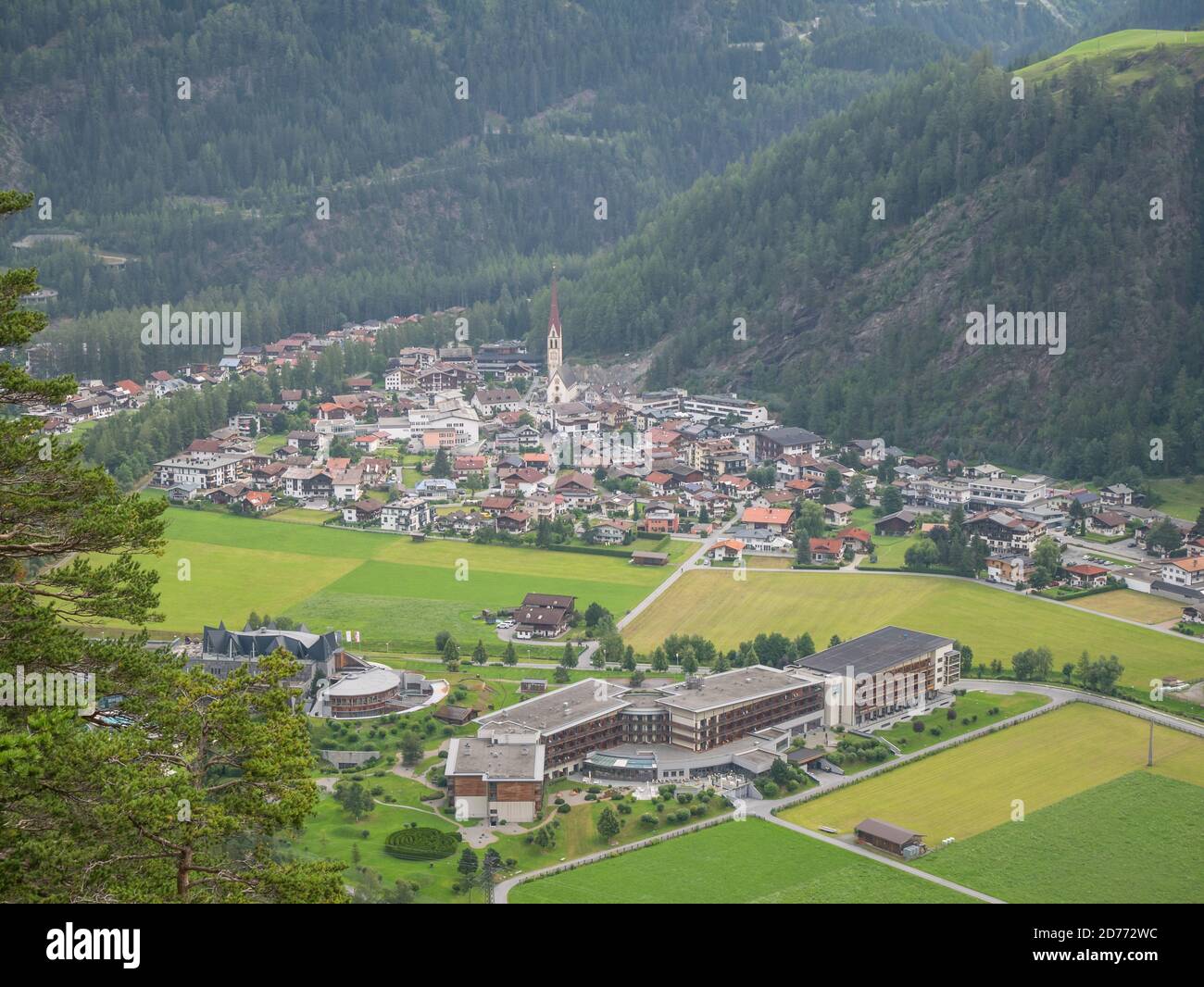 erial view over Längenfeld and the Aqua Dome alpine spa. Längenfeld, Tyrol, Austria Stock Photo