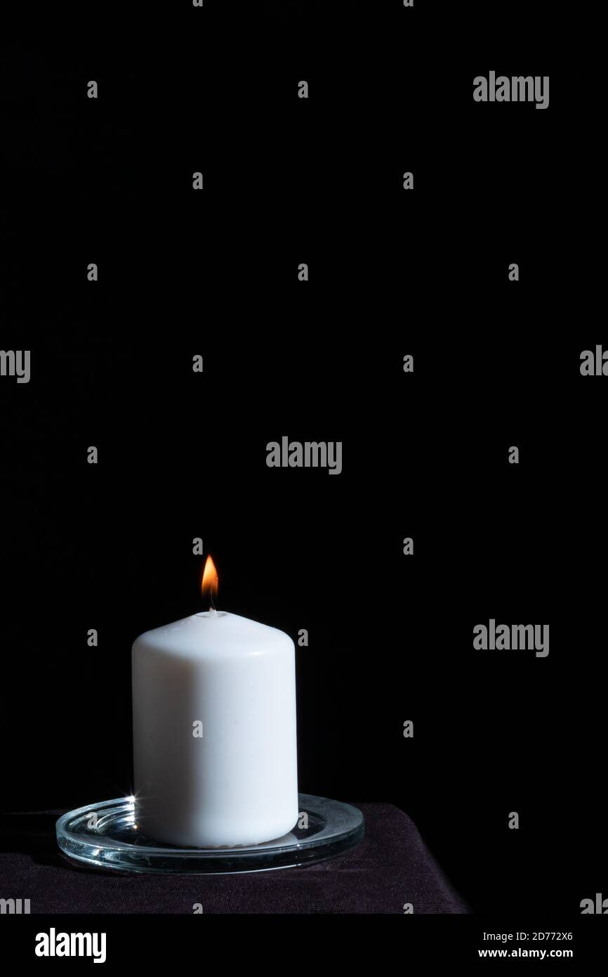 candle burning in the dark, halloween or prediction concept Stock Photo