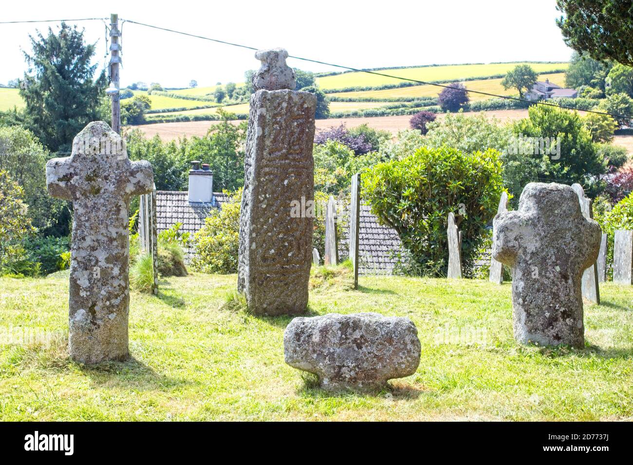 The remains of four old celtic stone crosses in the churchyard of St Neot's Church, St Neot, Cornwall, England, UK. Stock Photo