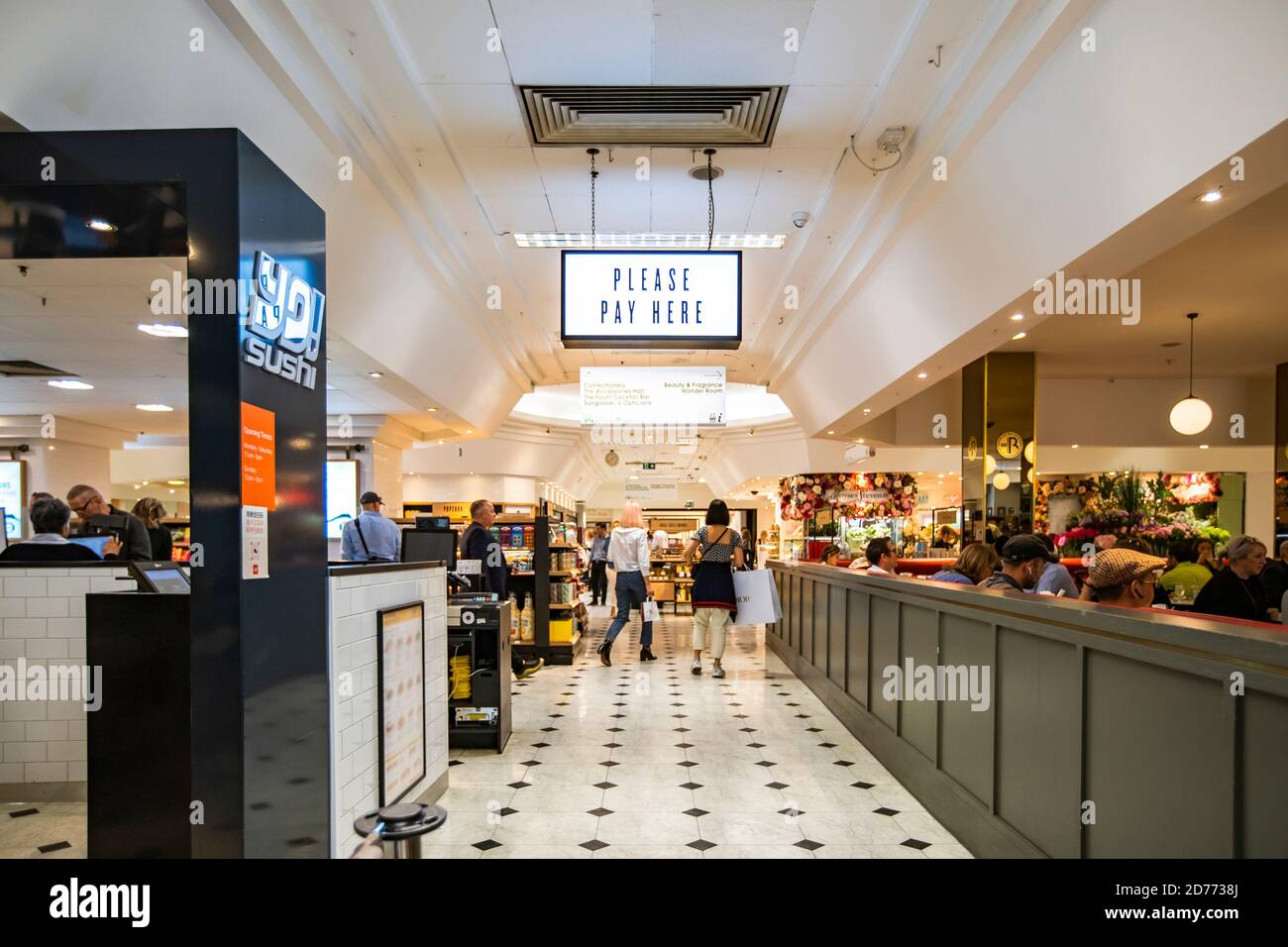 Selfridges food hall indoor store in London, UK, September 20, 2019: Please pay here sign inside a Selfridges food hall London uk. Stock Photo