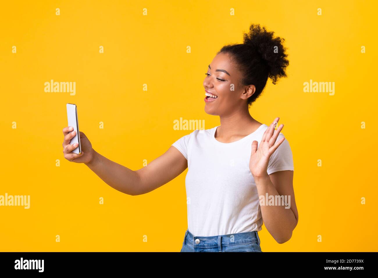 Happy black woman making video call using mobile phone Stock Photo - Alamy