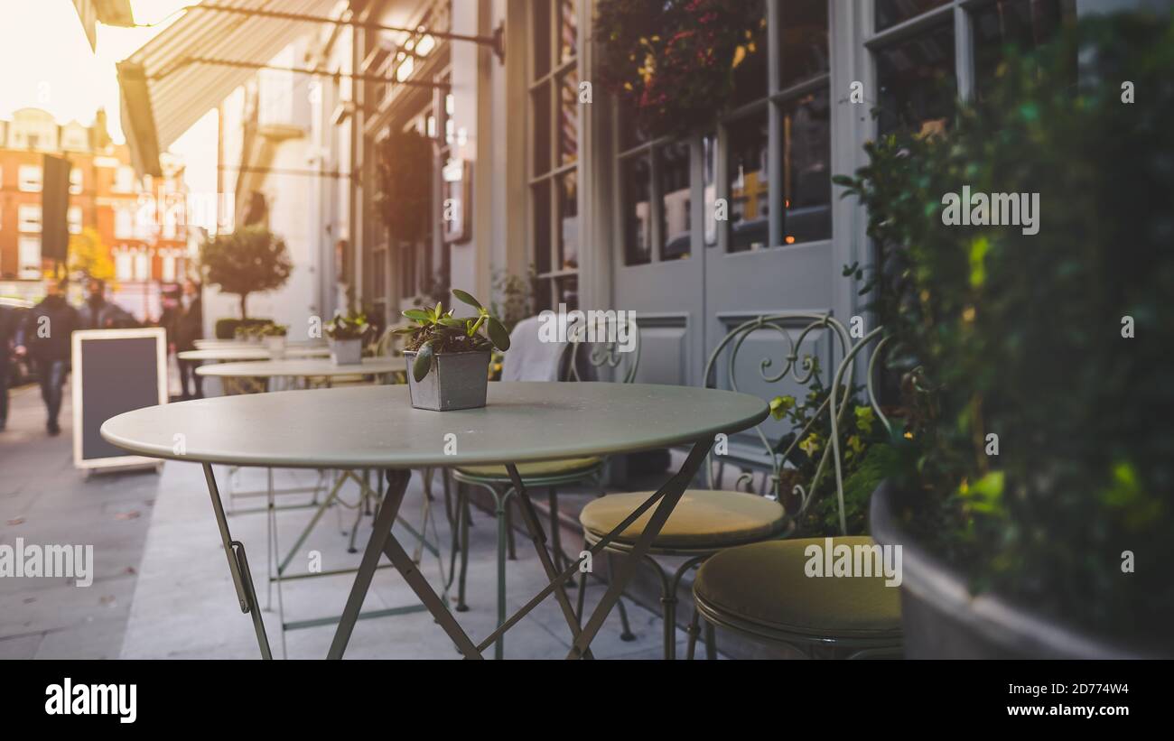 Empty coffee and restaurant terrace with tables and chairs in london Stock Photo