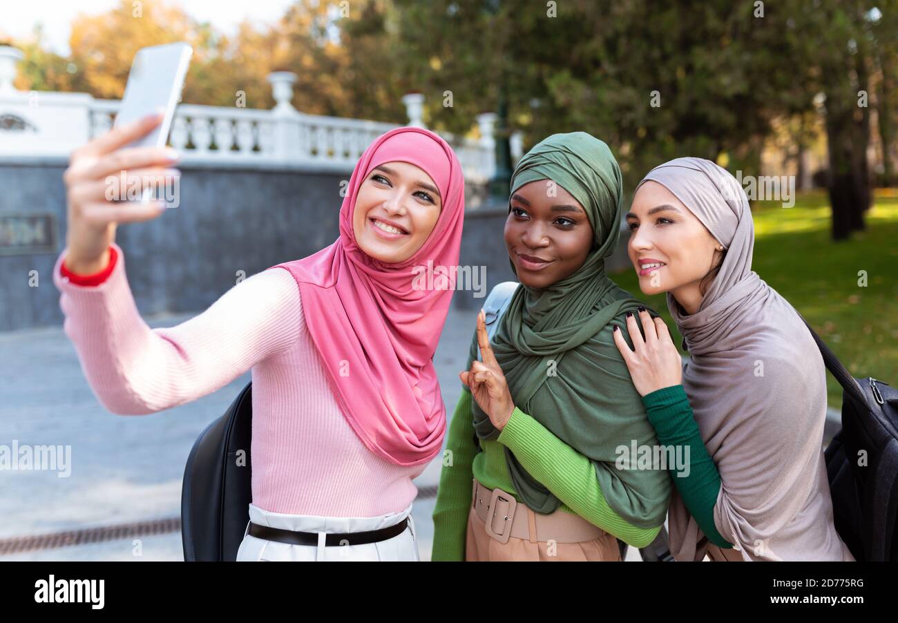 Three Modern Islamic Ladies Making Selfie
