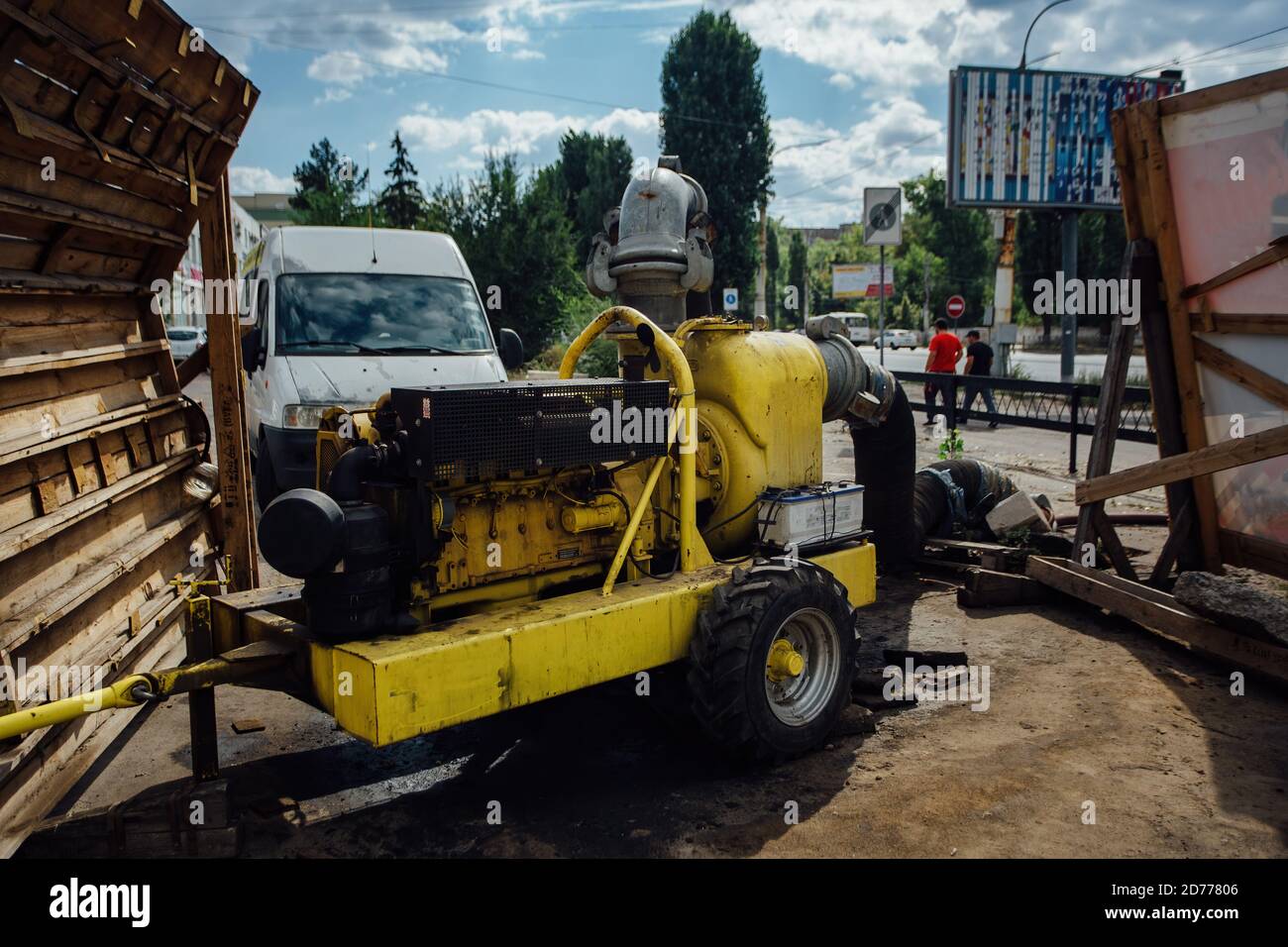 Cleaning sewer manholes by specialized pump machine on the street Stock ...