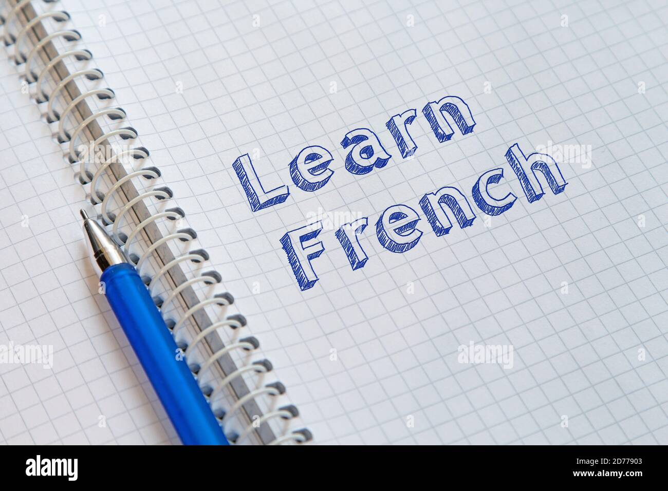 Learn French. Text handwritten on sheet of notebook Stock Photo Alamy