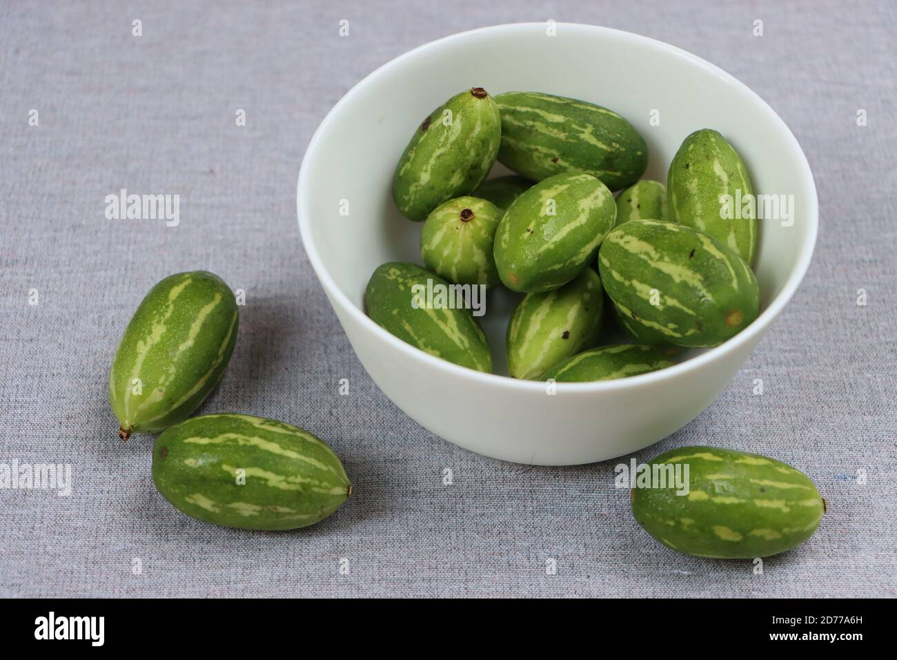 Ivy gourd or little gourds in white bowl Stock Photo