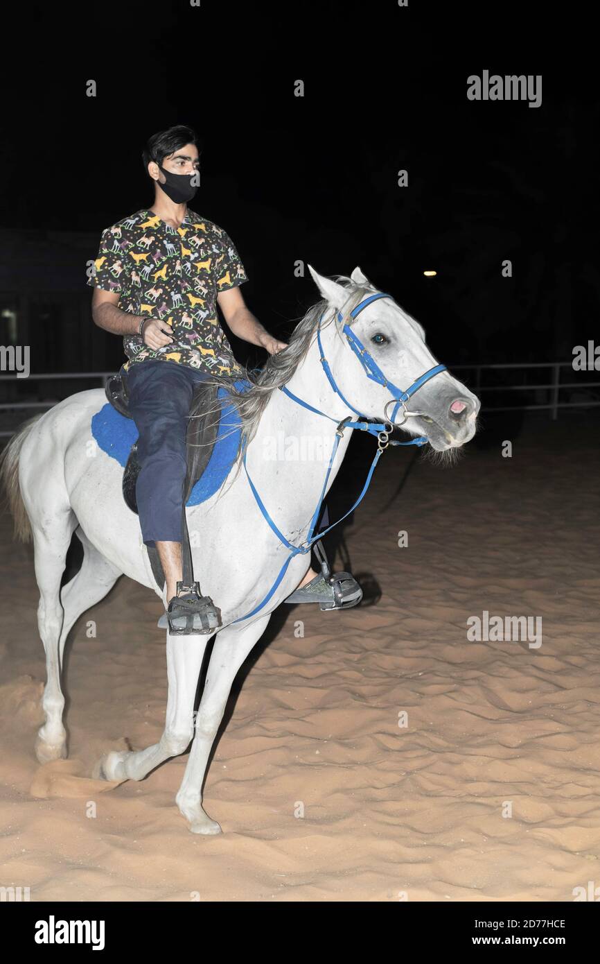 Black male riding white horse hi-res stock photography and images - Alamy