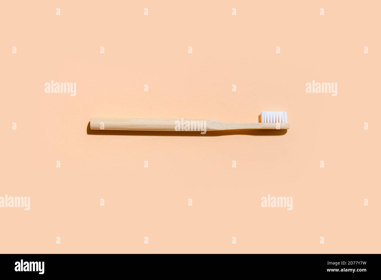 Toothbrush on camel color background. Zero Waste Home. Top view Stock Photo