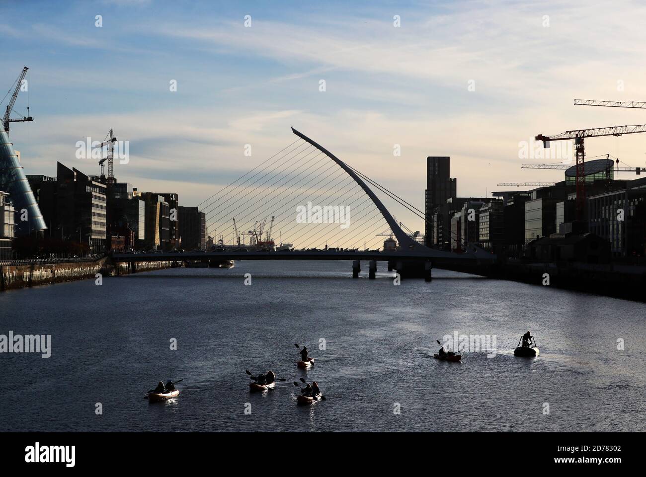People canoe on the river Liffey in Dublin's city centre on an autumn ...