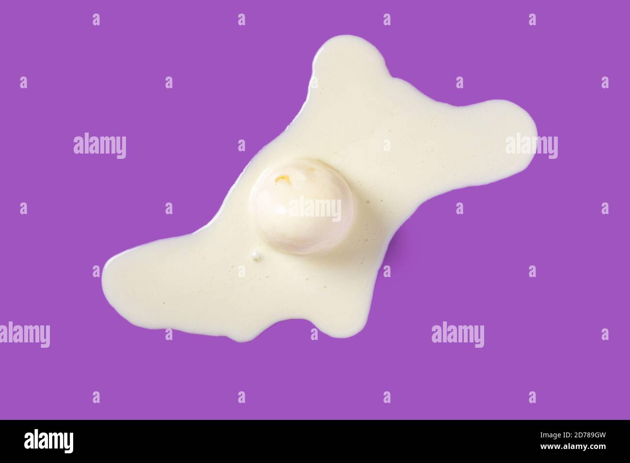 top view vanilla flavor ice cream ball in a melting process on purple background Stock Photo