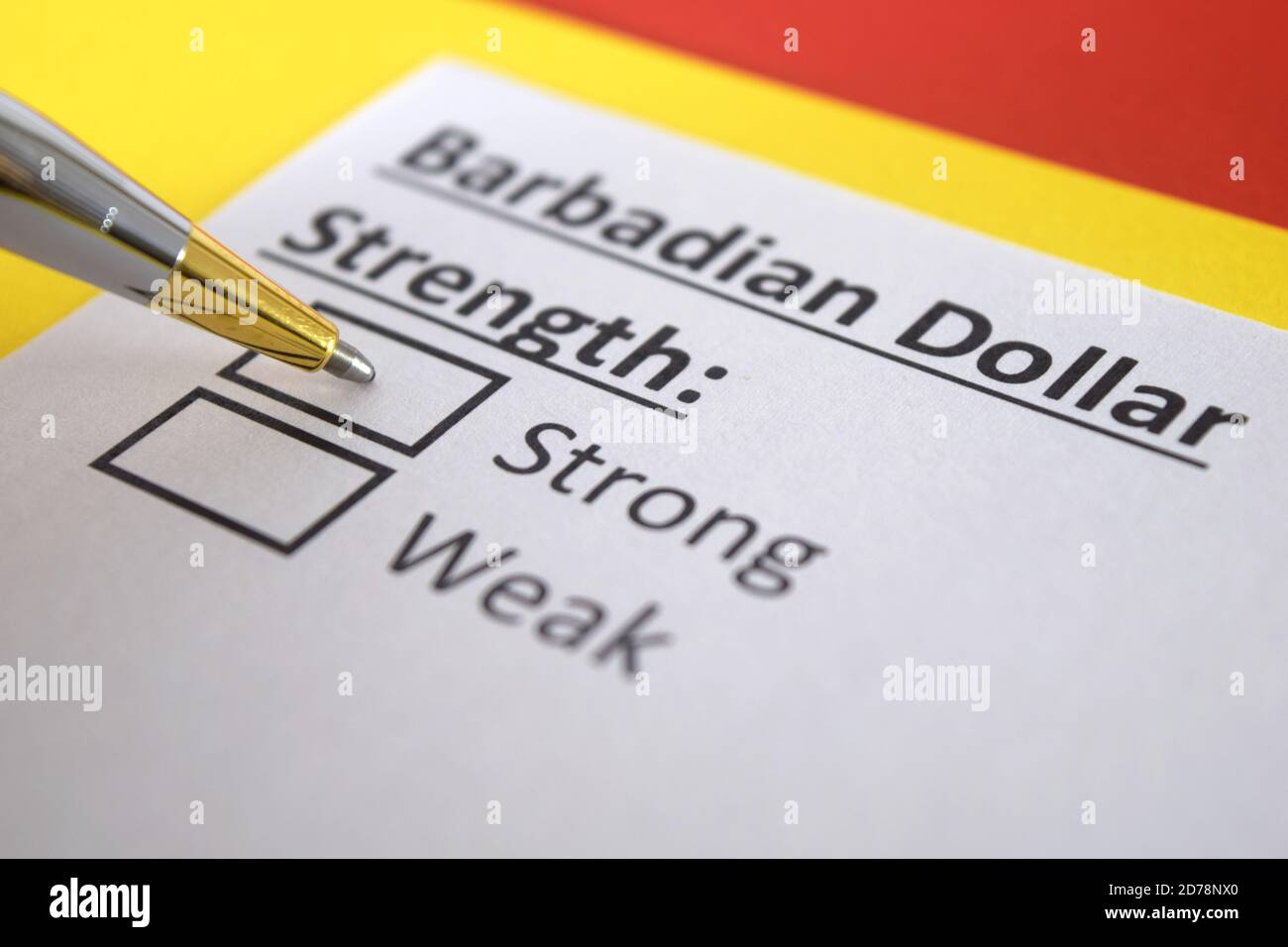 One person is answering question about strength of barbadian dollar. Stock Photo