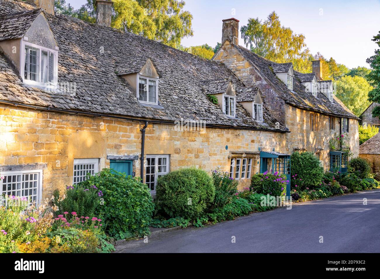 Evening light on traditional stone cottages in the Cotswold village of Snowshill, Gloucestershire UK Stock Photo