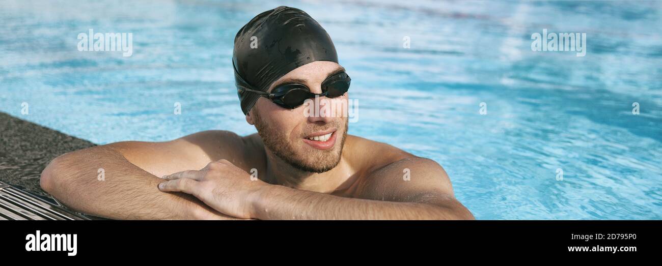Swimmer athlete man wearing sport goggles and swim cap in indoor swimming pool portrait panoramic banner crop. Portrait of sporty active person Stock Photo