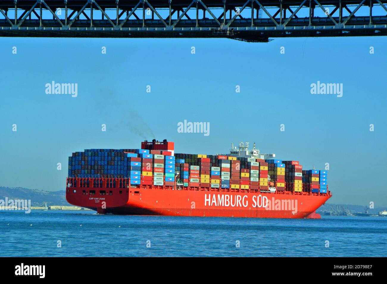 hamburg germany colorful container ship sails under the bay bridge in san francisco california usa Stock Photo