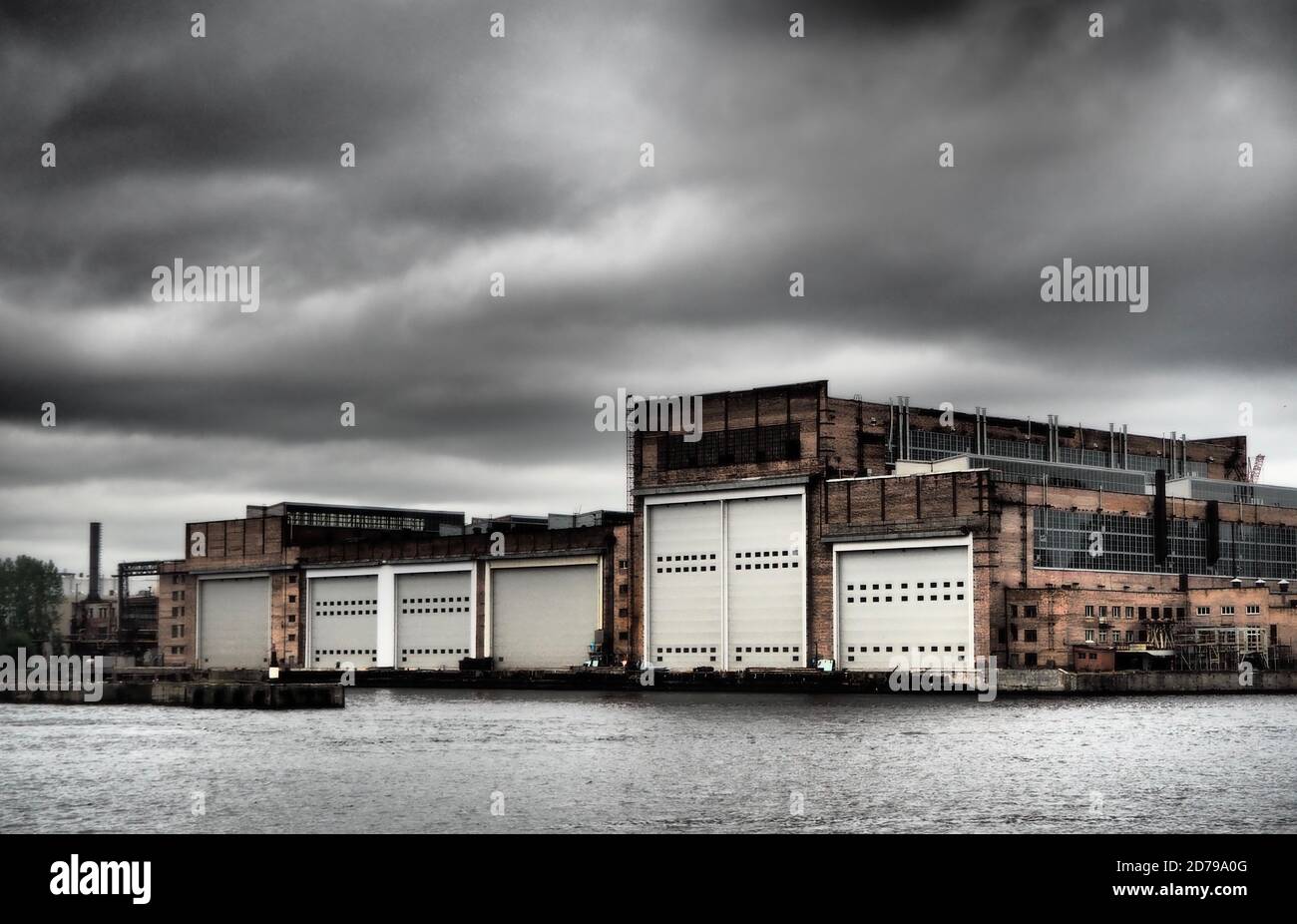 Boat building warehouses by the river in St Petersburg, Russia Stock Photo