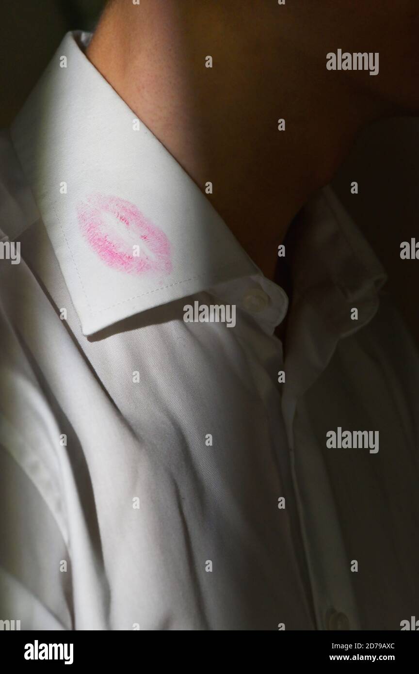 Lipstick marks on the collar of a men's white dress shirt Stock Photo