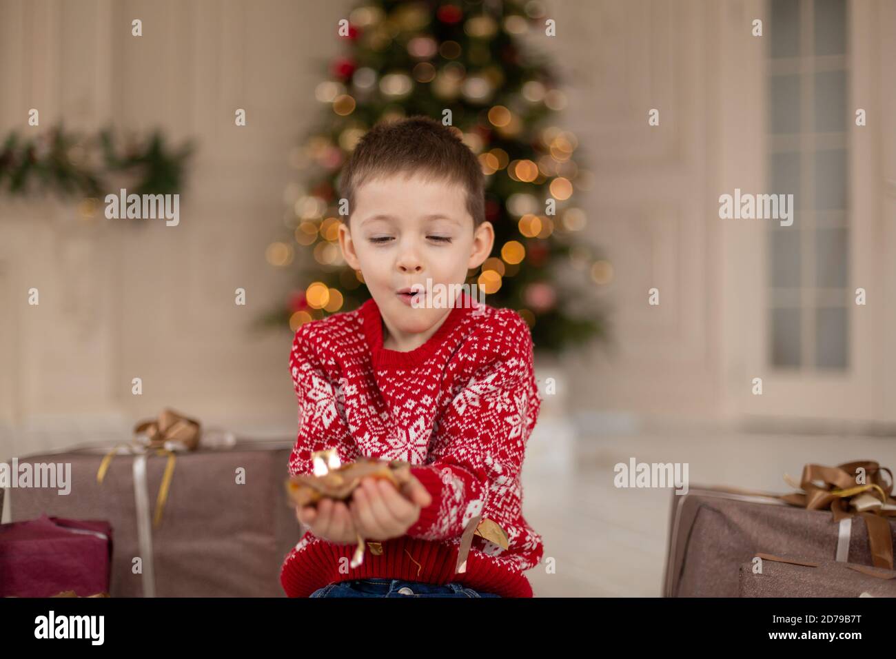 Christmas portrait little kid in confetti, teen boy wearing a red ...