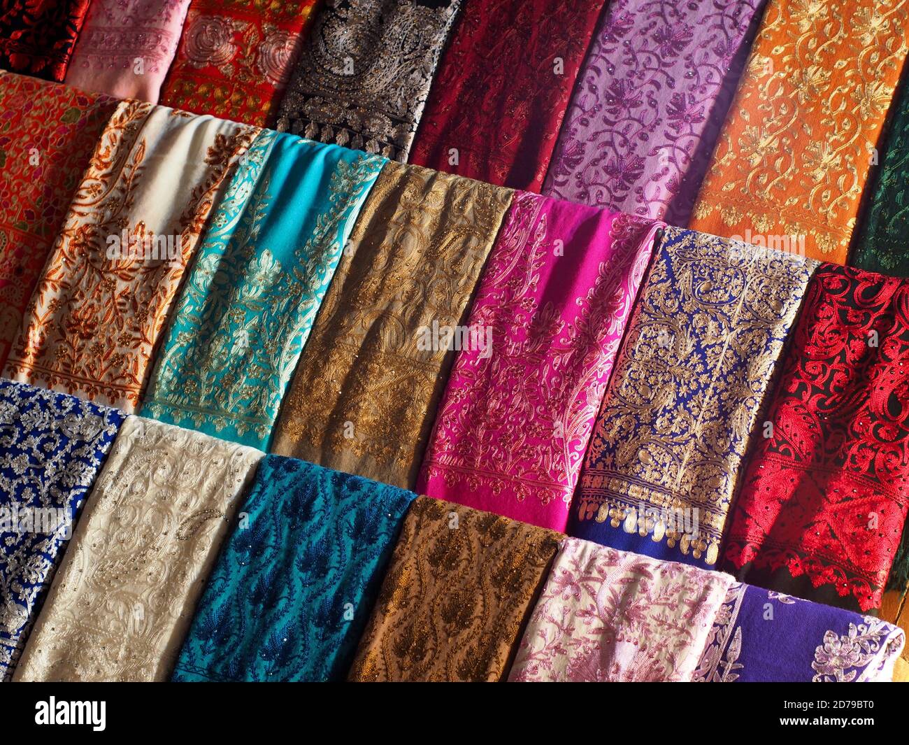 Colourful fabrics for sale in Souk in Dubai Stock Photo