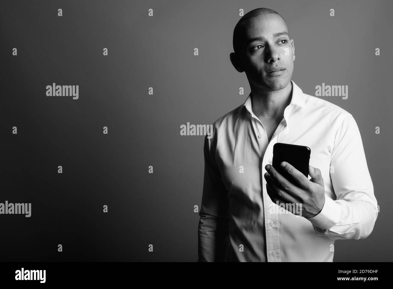 Handsome bald businessman using Black and White Stock Photos & Images ...