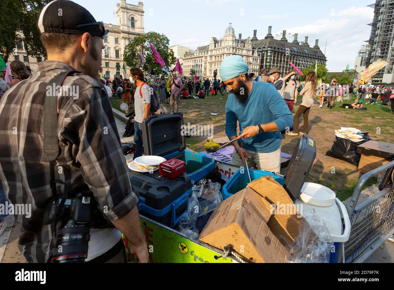 Hare Krishnas providing food to protesters during an Extinction Rebellion demonstration, Parliament Square, London, 10 September 2020 Stock Photo