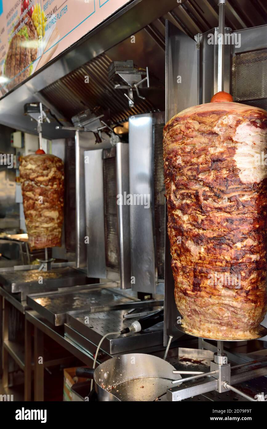 Pork and beef Giros turning on spits in Cypriot restaurant Stock Photo