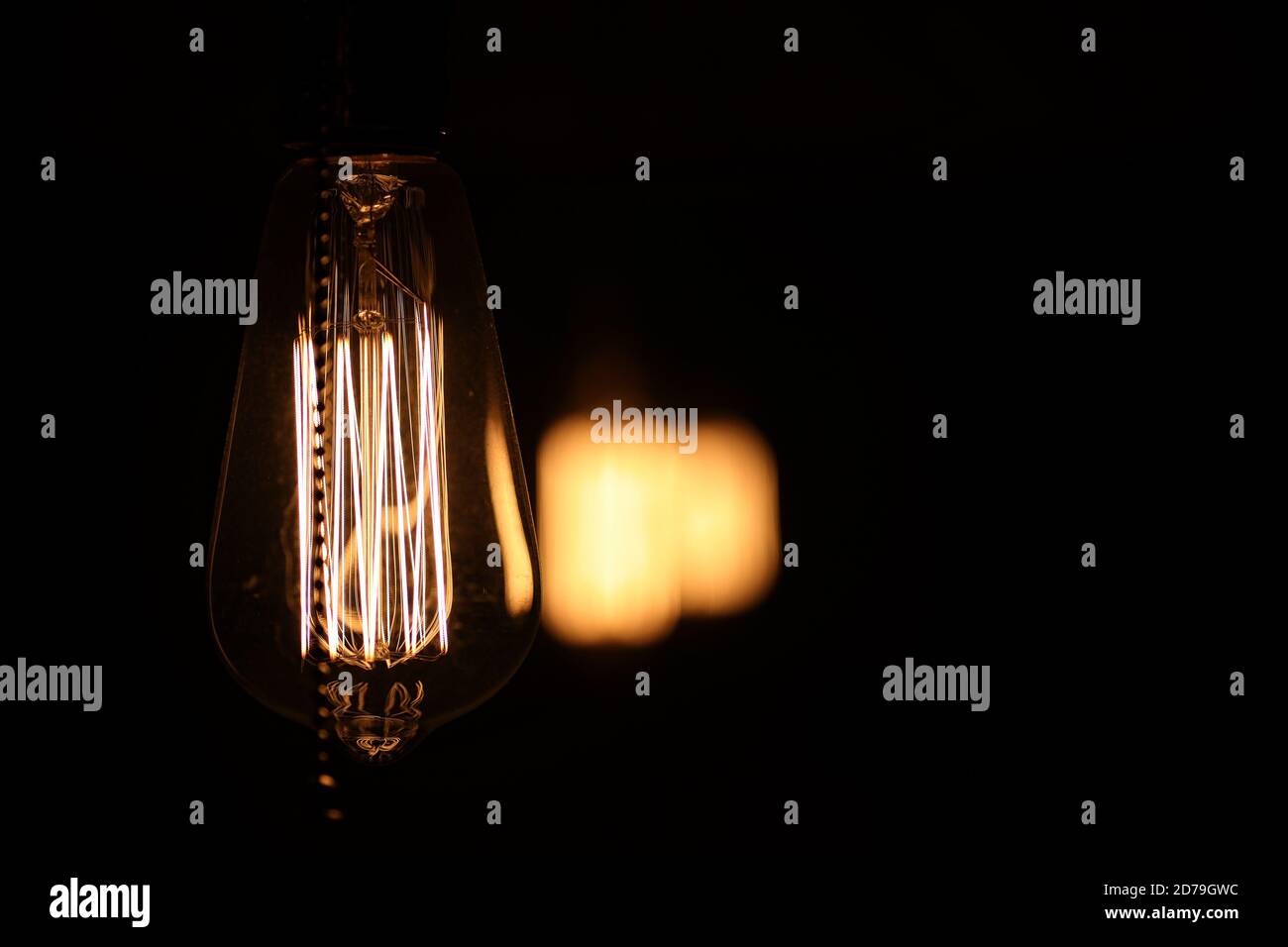 Lamps with tungsten filament. Edison's light bulb. Filament filament in