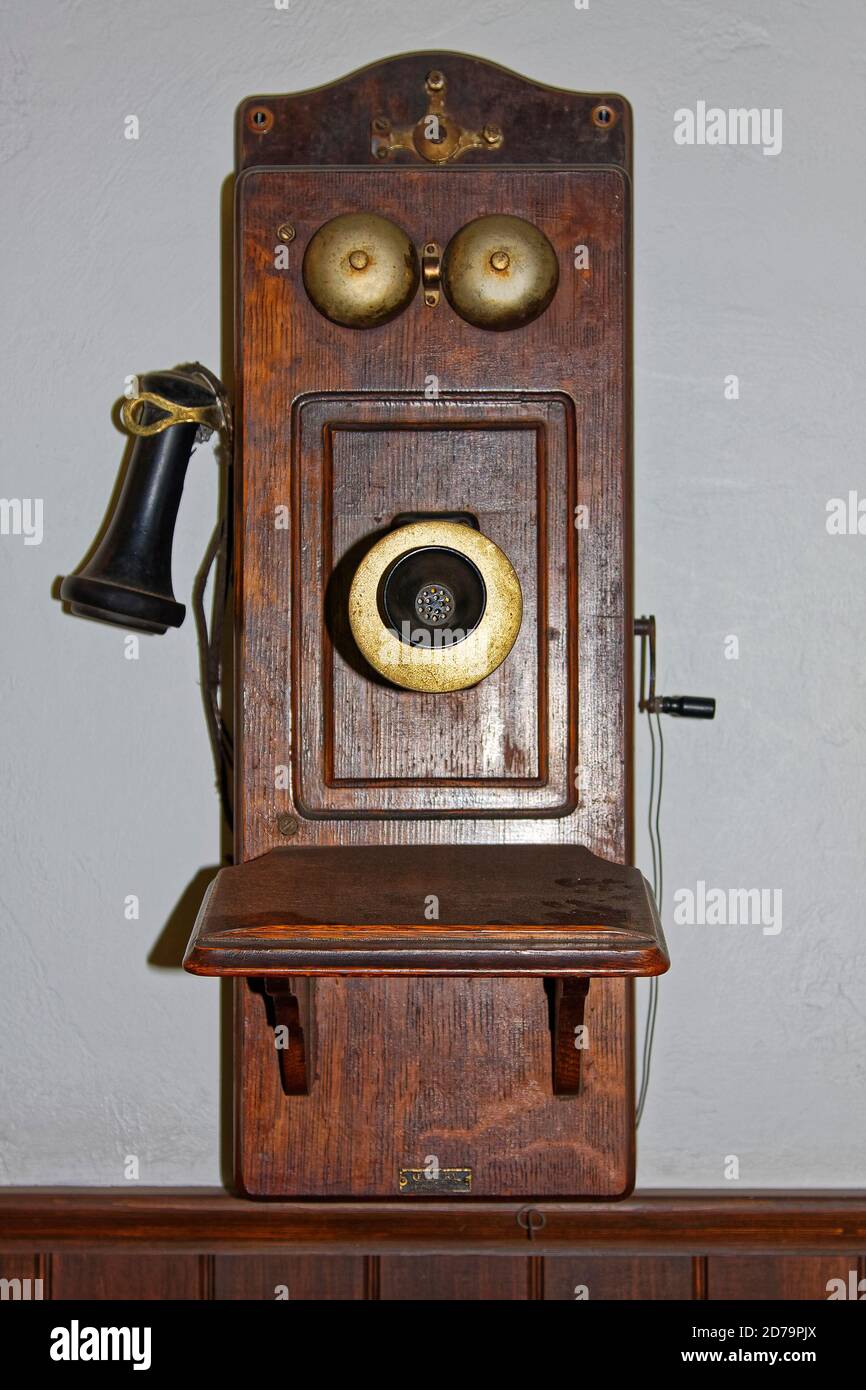 antique wall telephone, crank, crackled wood case, ear piece, mouthpiece, 2 bells, communication, old, Pennsylvania Stock Photo