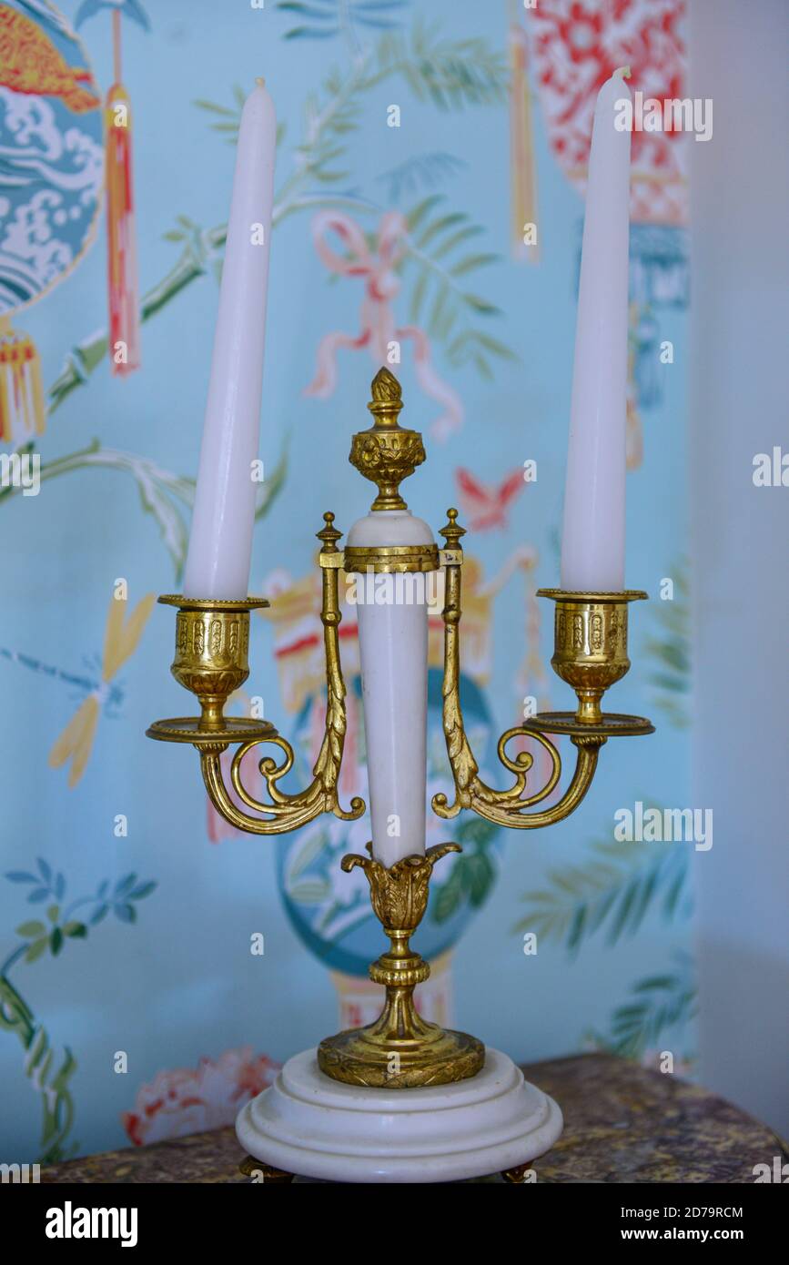 Antique gold candle holder. With a bright background Stock Photo Alamy