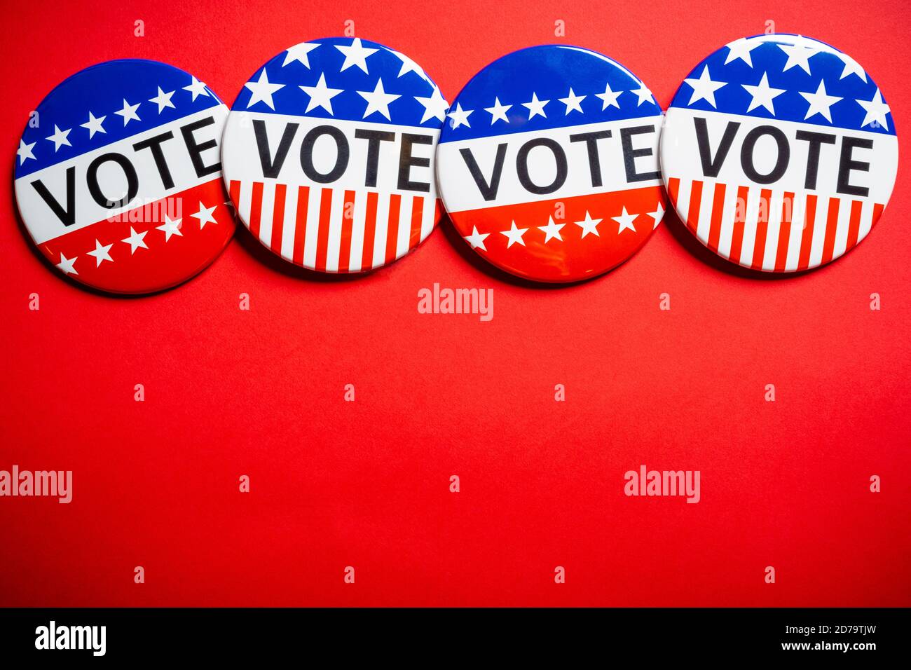 Vote buttons on red background with copy space. Election theme Stock Photo