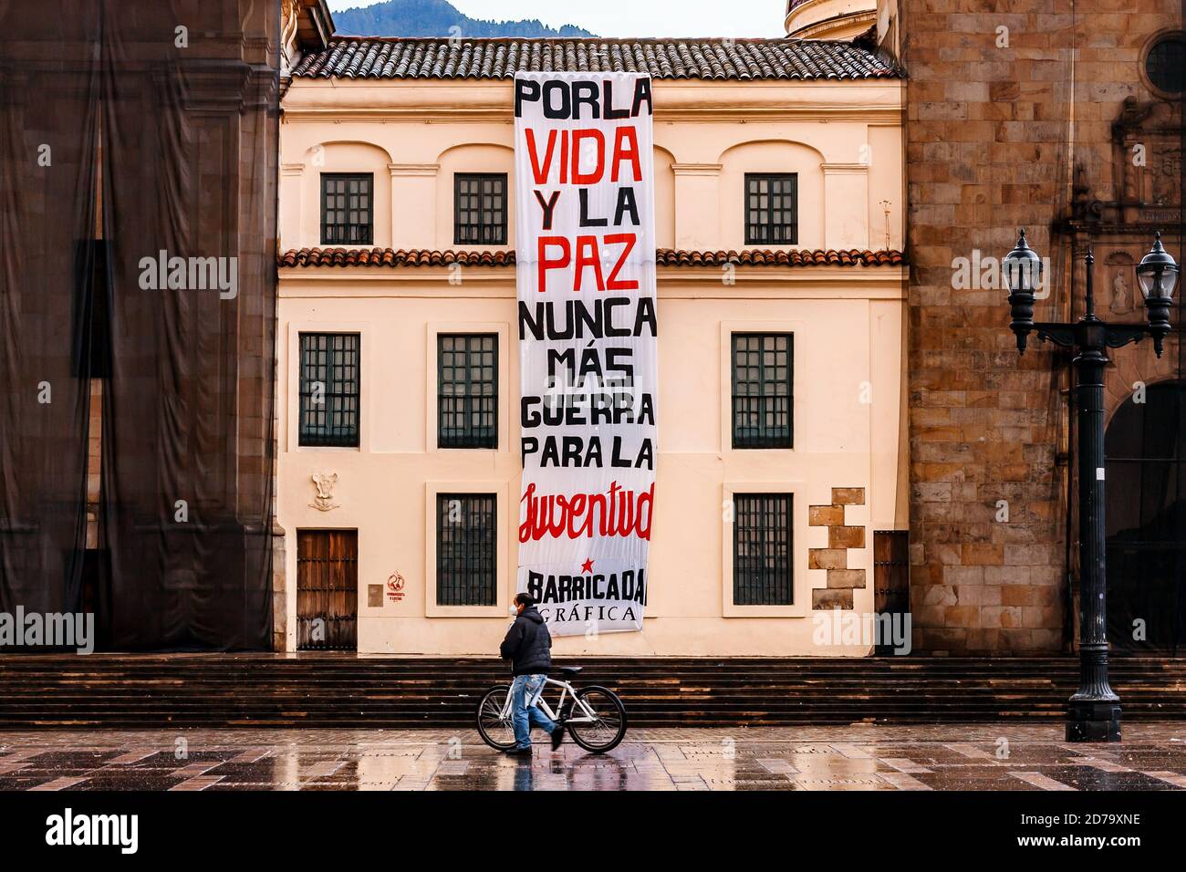 Facade of the Colombian episcopal conference, with a sign hung by protesters who marched against the murder of social leaders, Bogotá Colombia October Stock Photo