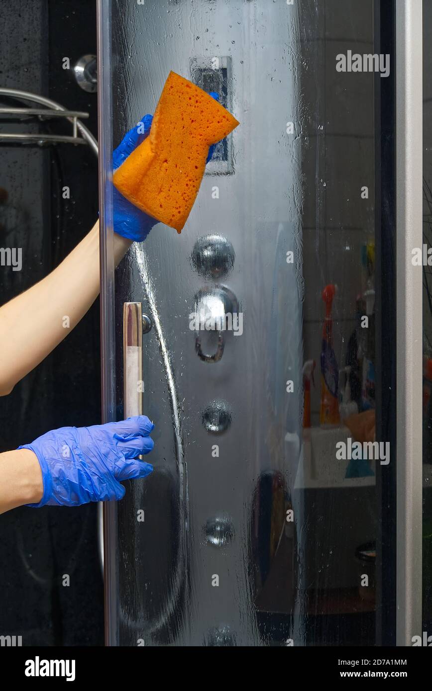 Cleaning of shower steam cabins from calcium deposits. Cleaning in the