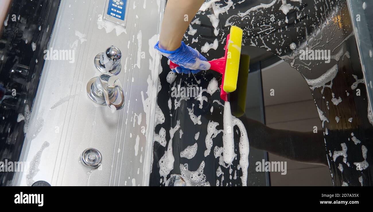 Cleaning of shower steam cabins from calcium deposits. Cleaning in the