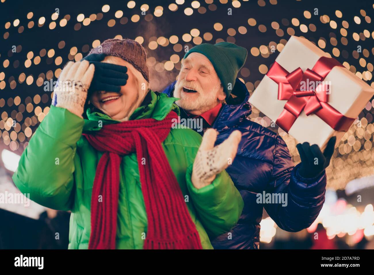 Two people old married couple lover parents celebrate x-mas christmas noel  tradition party man give wife dream gift box close cover gloves eyes under  Stock Photo - Alamy