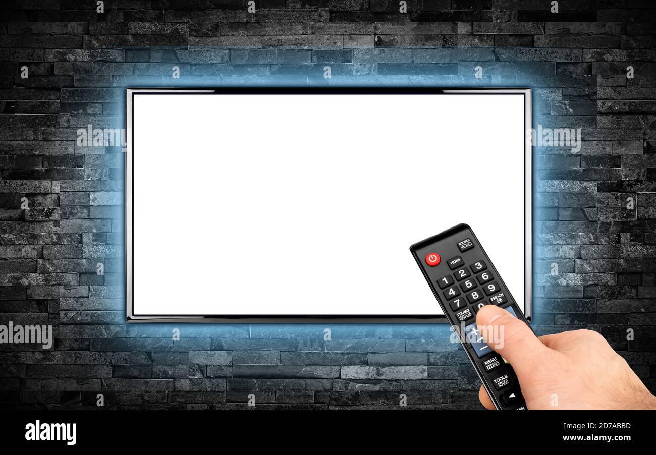 hand with remote on empty black flat tv screen display with copy space