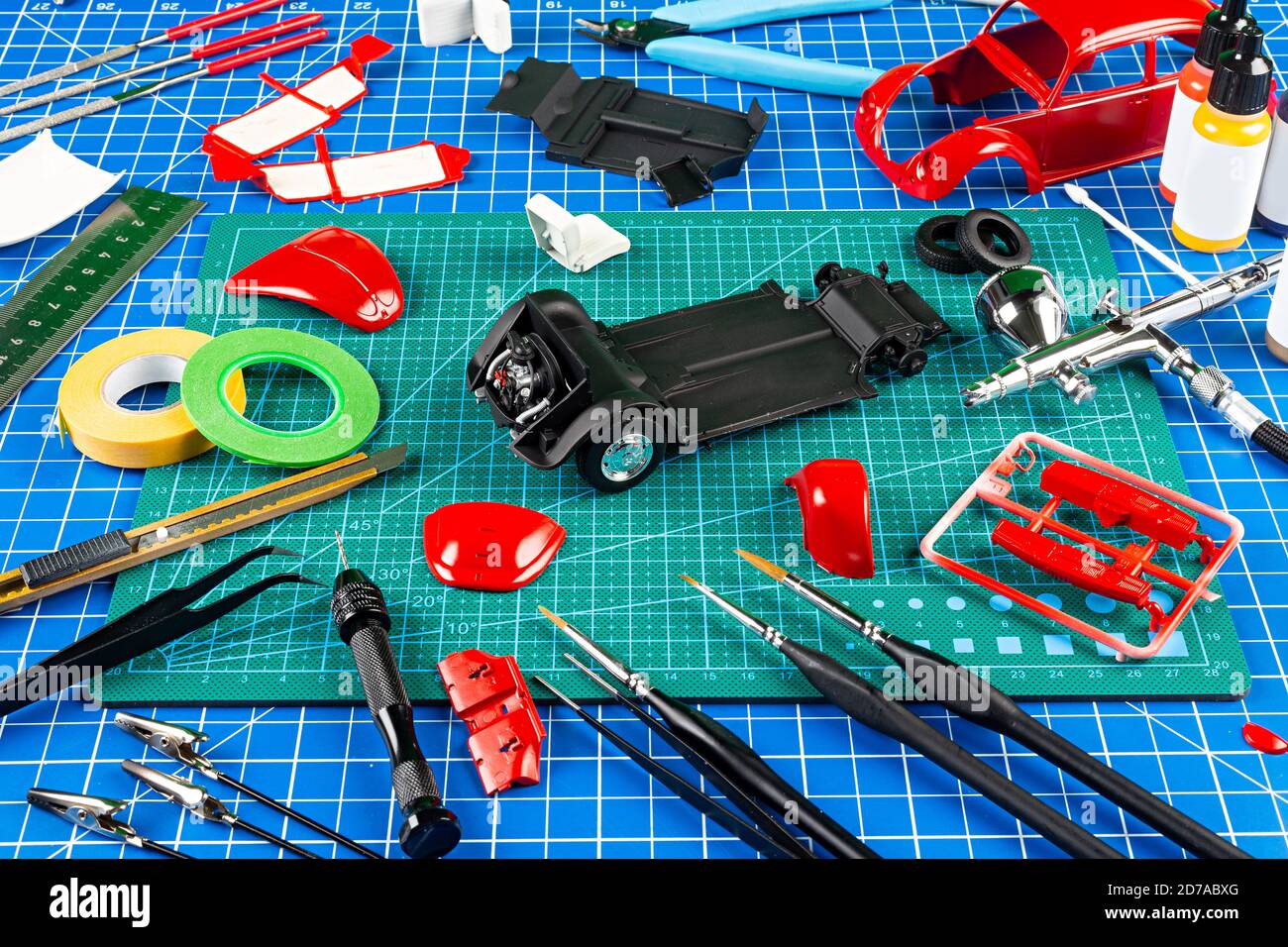 Plastic model kit and tools, hobby workplace background top view. Stock  Photo
