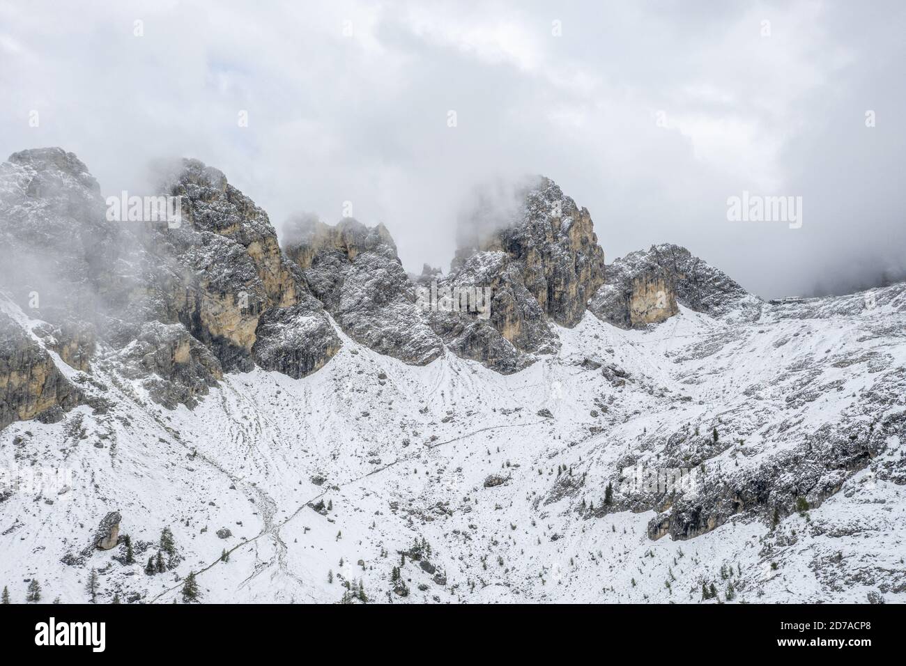 Dolomites covered in the snow and fog at daylight in Italy - great for ...
