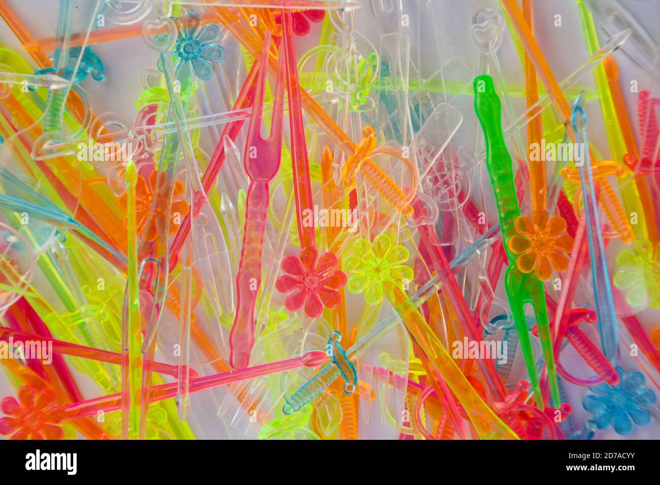 Set of small colored plastic cutlery for decorating appetizers at parties. Stock Photo