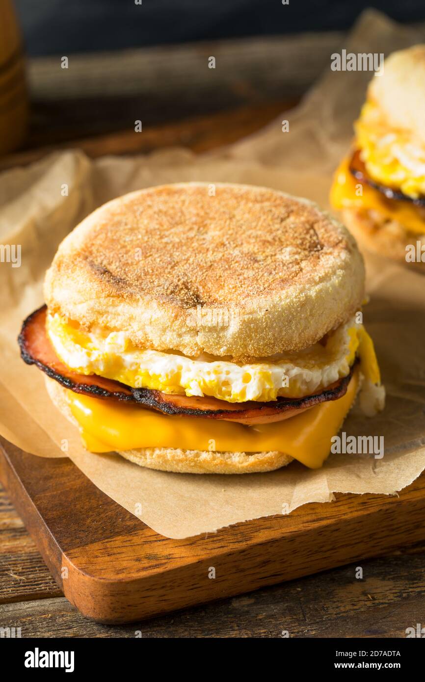 Homemade Egg English Muffin Sandwich with Bacon and Cheese Stock Photo