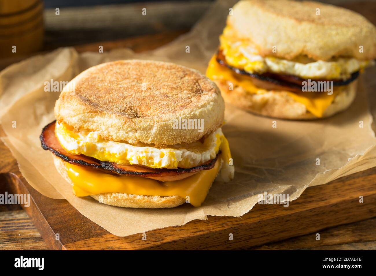 Homemade Egg English Muffin Sandwich with Bacon and Cheese Stock Photo