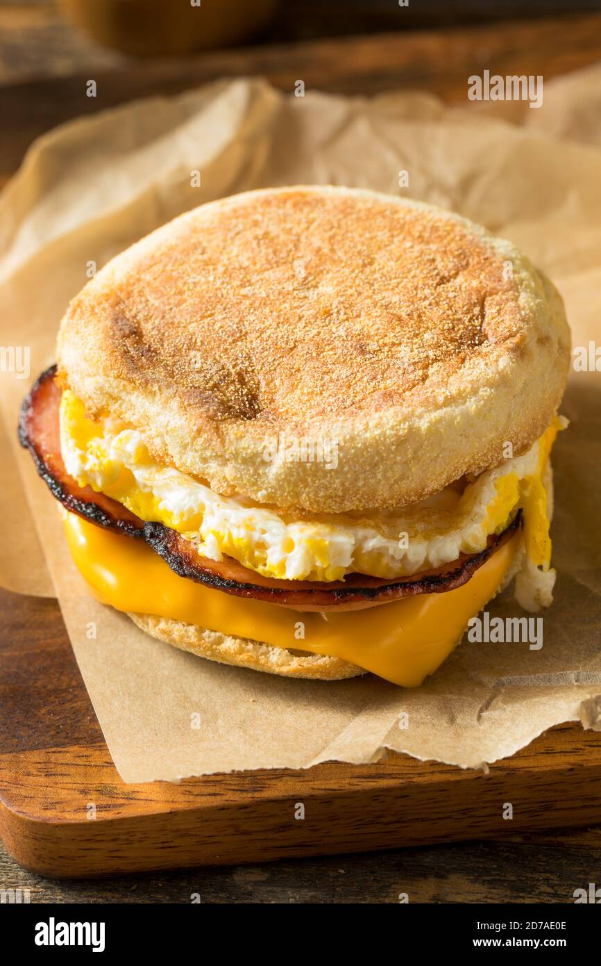 Homemade Egg English Muffin Sandwich with Bacon and Cheese Stock Photo