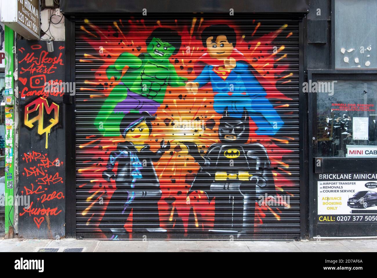 Lego figures painted on the shutters of Yono unique street food shop in Bricklane, London. Stock Photo