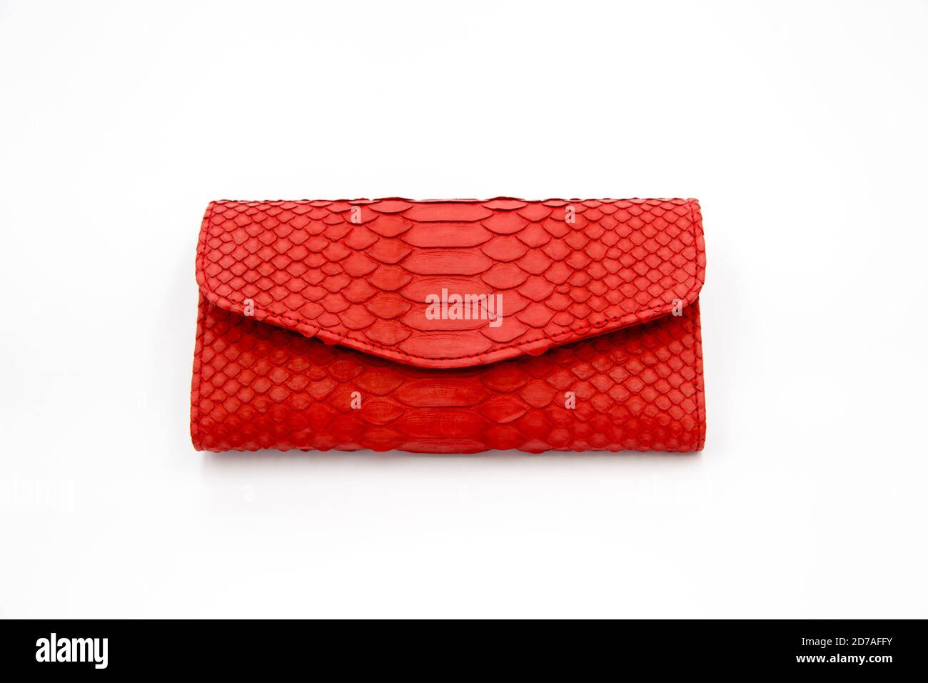 Trendy natural red snake python skin woman wallet on white isolated background. Can be used for background and wallpaper Stock Photo