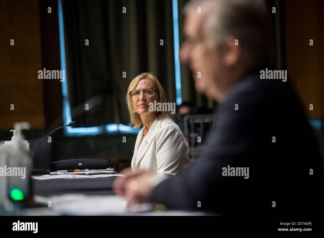 OptumServe CEO Lt. Gen. Patricia D. Horoho, left, listens while TriWest Health Alliance President and CEO David J. McIntyre, Jr., right offers remarks as they appear before a Senate Committee on Veterans Affairs hearing to examine VA MISSION Act, focusing on assessing progress implementing Title I, in the Dirksen Senate Office Building on Capitol Hill in Washington, DC, Wednesday, October 21, 2020. Credit: Rod Lamkey/CNP /MediaPunch Stock Photo