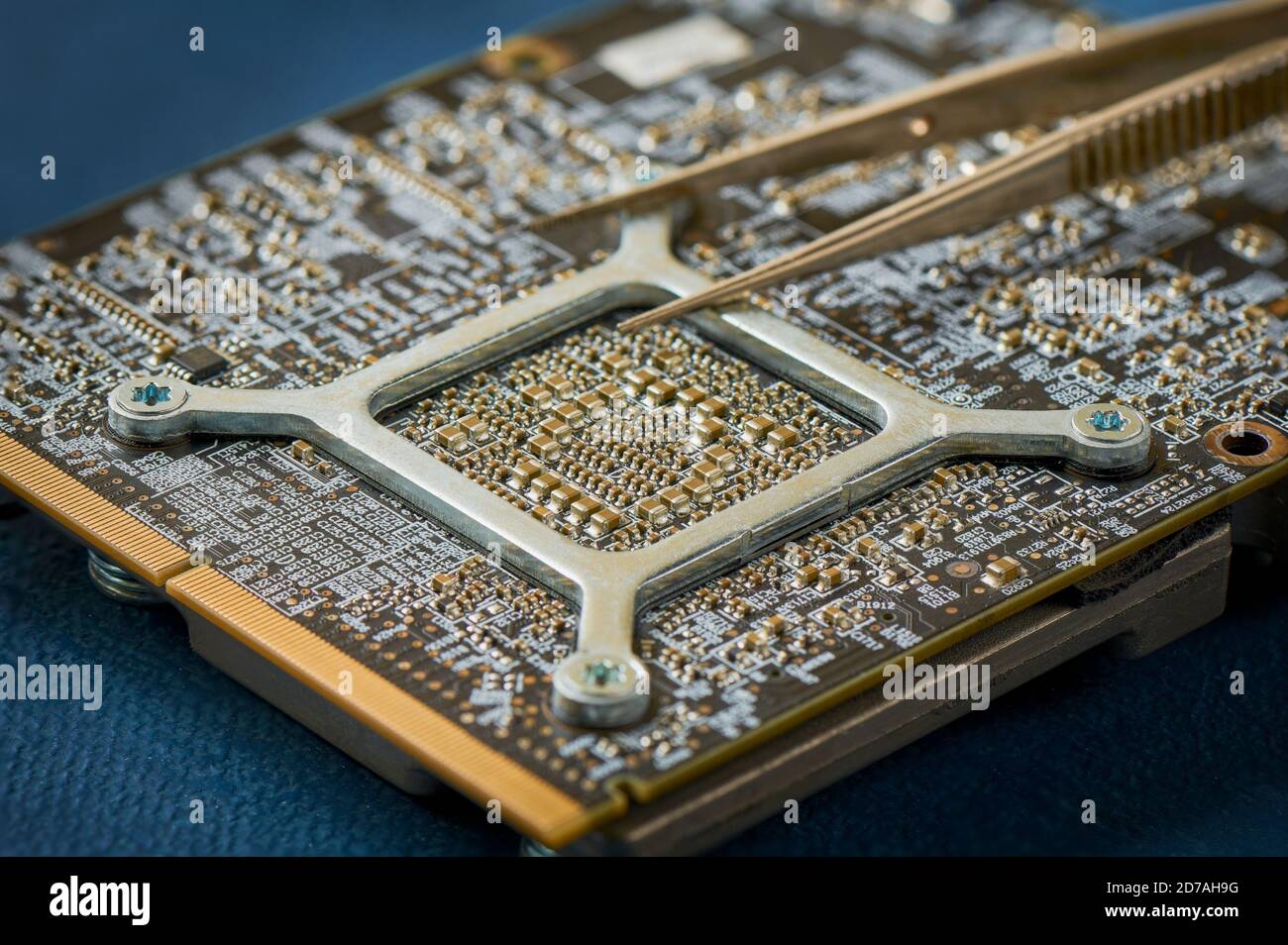 Electronic circuit board on blue background close up Stock Photo